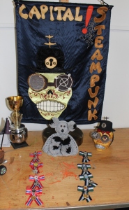 Featuring the Tea Cosy of Doom and the Winners medals. (Hand made by me)